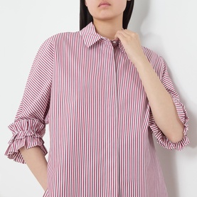 Model wearing Max Mara S Nebbie Striped Ruffle Sleeve Shirt in bordeaux stripe with ruffled cuffs and classic collar
