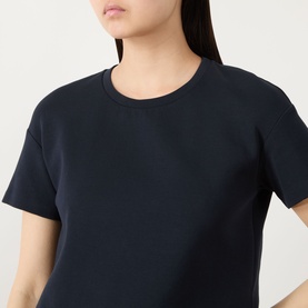 Model wearing Max Mara S Ultramarine cotton blend T-shirt, cropped view showing crew neckline and short sleeves.
