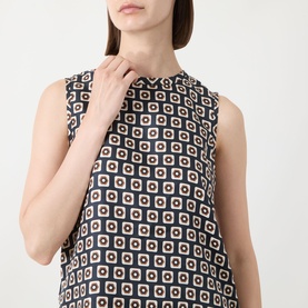 Model wearing Max Mara S Giornata Silk Printed Blouse in Ultramarine, sleeveless with crew neckline and geometric square print