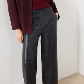 Model wearing Max Mara S Amati Coated Cropped Trousers in Ultramarine, straight-leg, mid-rise, styled with a burgundy top and jacket
