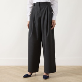 Model wearing Max Mara S Taro High-Waisted Wide Leg Trousers in dark grey, styled with a white shirt and navy heels.