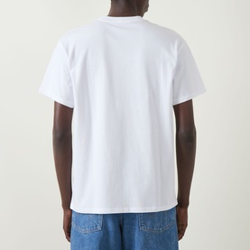 Model wearing Carhartt Script Embroidered Logo T-Shirt in white, crew neck, short sleeves, back view, styled with blue jeans.