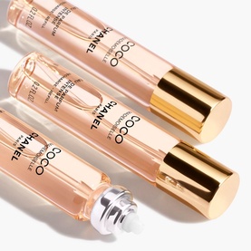 Chanel Coco Mademoiselle Eau de Parfum twist and spray refillable set, three slim gold-capped tubes, one with roller ball visible