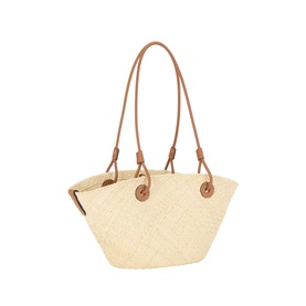 Loewe Anagram Woven Small Basket Bag in natural straw with tan leather top handles, knotted leather ties, and embroidered Anagram detail.