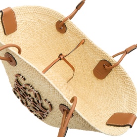 Loewe Anagram Woven Small Basket Bag in natural/tan, showing interior view with handwoven body, embroidered Anagram detail and tan leather straps.