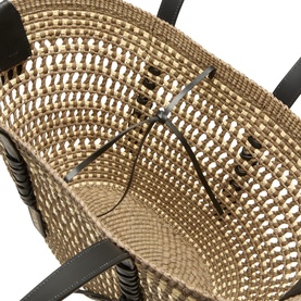 Loewe Braid Medium Basket Bag in khaki and natural iraca weave, close-up showing open-weave detail, leather handles and tie closure.