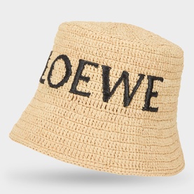 Loewe Raffia Logo Bucket Hat in natural, woven raffia with black embroidered LOEWE lettering and wide brim bucket shape.