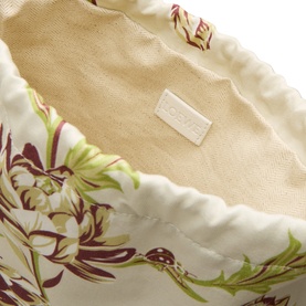 Loewe Artichoke Small Drawstring Pouch in white cotton, interior view showing floral print lining and embossed logo label.