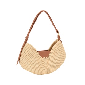 Loewe raffia shoulder bag in natural and tan, with whipstitch trim, crescent silhouette, and tan leather top handle and trim detail.