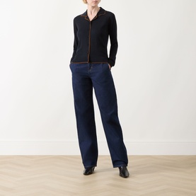 Model wearing Max Mara Studio Targa Knit Cardigan in ultramarine with flat collar and contrast details, styled with wide-leg dark jeans and black