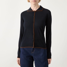 Model wearing Max Mara Studio Targa Knit Cardigan in ultramarine with tan contrast trim, flat collar, button fastening, styled with blue jeans.