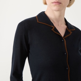 Model wearing Max Mara Studio Targa Knit Cardigan in Ultramarine with tan contrast trim, flat collar, and button fastening