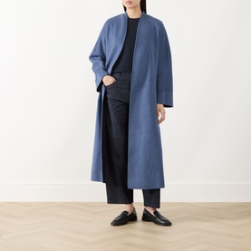 Model wearing Max Mara Studio Navy Bicolour wool coat, longline collarless silhouette, styled with black trousers and loafers