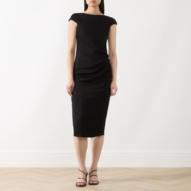 Model wearing Max Mara Studio black cap-sleeve midi dress with ruched side detail, styled with strappy black heeled sandals.