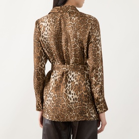 Model wearing Max Mara Studio brown spotted leopard-print silk jacket with belted waist, seen from the back.