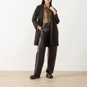 Model wearing Max Mara Studio Brown Spotted silk jacket, styled with dark wool coat, brown leather trousers and black loafers