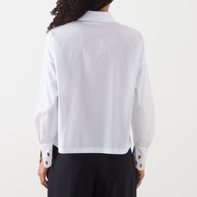 Model wearing Max Mara Studio Staffa Broderie Anglaise Shirt in Optical White, back view, with embroidered cuffs and cropped length. Styled with dark