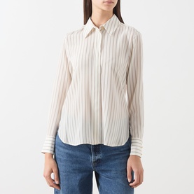 Model wearing Max Mara Studio Natural Stripe silk shirt with classic collar and chest pocket, styled with blue jeans.