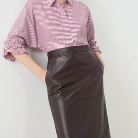 Model wearing Max Mara Studio bordeaux lamb leather midi skirt with front pockets, styled with a pink striped shirt.