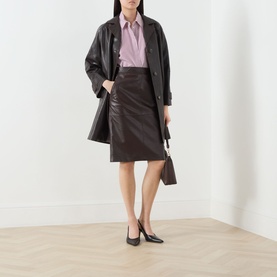 Model wearing Max Mara Studio bordeaux lamb leather pencil skirt, styled with matching coat, pink shirt and black heels.