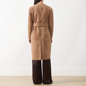 Model wearing Max Mara Studio camel lamb leather trench coat with self-tie belt, styled with dark brown wide-leg trousers, back view.