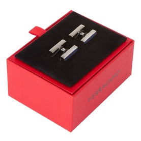 Salvatore Ferragamo silver cufflinks with blue enamel detail, presented in a red branded gift box with black velvet interior.