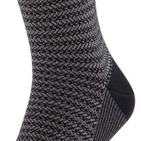 Falke black marl-knit ankle socks with contrast heel detail, shown as a close-up of the foot and ankle section