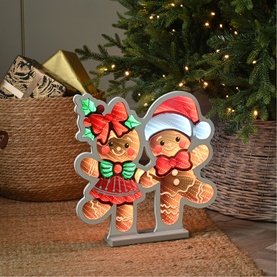 Festive Productions Infinity Dancing Gingerbread 40cm light-up decoration with LED-lit boy and girl gingerbread characters, styled near a Christmas