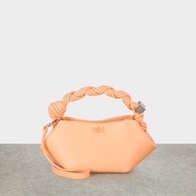 Ganni Bou Mini Crossbody Bag in Cantaloupe with braided top handle, silver-tone hardware, and detachable crossbody strap