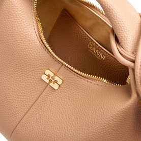 Ganni Hobo Mini Crossbody Bag in Tawny Birch, close-up of gold-tone zip fastening and Butterfly hardware logo detail