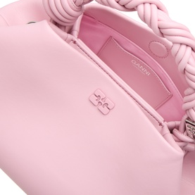 Ganni Pink Nectar crossbody bag, close-up of braided top handle, logo charm detail, and open interior with card slot visible.