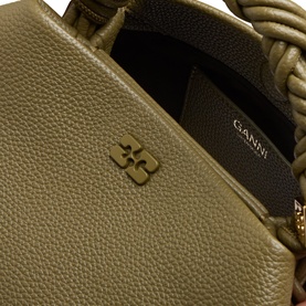 Ganni Bou Small Crossbody Bag in Military Olive, close-up showing tonal Butterfly logo, textured finish, and braided handle with gold-tone hardware.