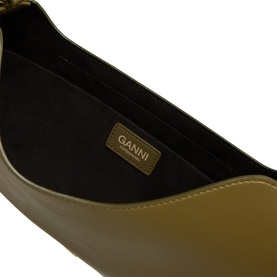 Ganni Military Olive leather shoulder bag interior, showing dark lining and gold-tone branded logo patch
