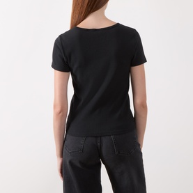 Model wearing Levi's T-Shirt in Anthracite Night, back view, short sleeves, scoop neck, styled with dark wide-leg trousers.