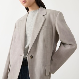 Model wearing Max Mara Weekend Attila Single-Breasted Oversized Blazer in hazelnut, styled with grey knit and blue jeans