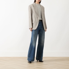 Model wearing Max Mara Weekend Attila Single-Breasted Oversized Blazer in hazelnut, styled with grey knit and wide-leg dark wash jeans.