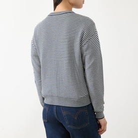 Model wearing Max Mara Weekend Teiera Stripe Cardigan in navy pinstripes, back view, styled with dark blue jeans