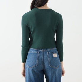 Model wearing Max Mara Weekend Tennis Ribbed Cropped Cardigan in green, long sleeves, round neck, styled with light wash wide-leg jeans, rear view.