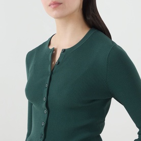 Model wearing Max Mara Weekend Tennis Ribbed Cropped Cardigan in green with round neckline and front button fastening