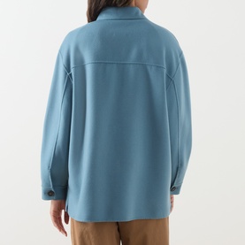 Model wearing Max Mara Weekend light blue wool overshirt coat, rear view, with tan trousers visible below hemline.