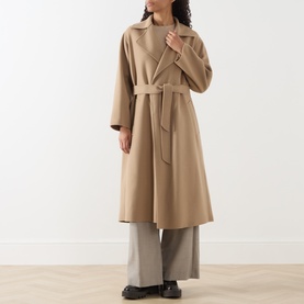 Model wearing Max Mara Weekend camel wool belted wrap coat, styled with wide-leg grey trousers