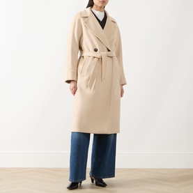 Model wearing Max Mara Weekend sand wool belted coat with notch lapels, styled with blue wide-leg jeans.