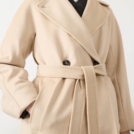 Model wearing Max Mara Weekend sand wool coat with wide lapels, single button fastening, and tie belt at waist.