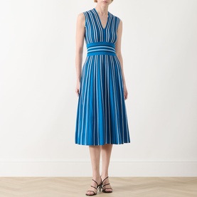 Model wearing Max Mara Main Agreste Stripe Dress in Ocean, sleeveless V-neck midi with fitted waistband and flared skirt, styled with strappy black