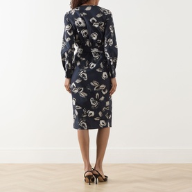 Model wearing Max Mara Main ultramarine floral cotton dress, long sleeves, midi length, back view, styled with black heeled sandals.