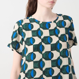 Model wearing Max Mara Weekend Vinci Printed Dress in dark green geometric circle print, round neckline, short sleeves, 100% silk