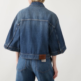 Model wearing Max Mara Weekend Liuti Denim Jacket in Navy Vintage, rear view, with wide three-quarter sleeves and logo patch, styled with matching