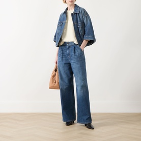 Model wearing Max Mara Weekend Liuti Denim Jacket in Navy Vintage with wide-leg jeans, styled with a cream top and brown bag.