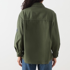 Model wearing Max Mara Weekend khaki cotton jacket, rear view, with embroidered sleeve detail and button cuffs, styled with blue jeans