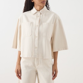 Model wearing Max Mara Weekend ecru cotton cropped jacket with chest pockets and short sleeves, styled with matching wide-leg trousers